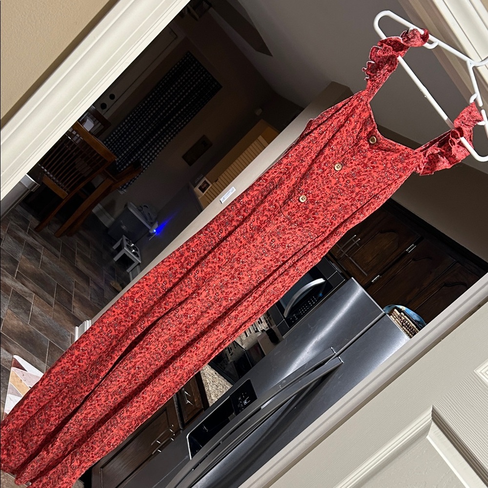 Girls jump suit in orange with red flowers